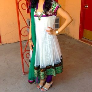 White anarkali with purple leggings and emerald dupatta